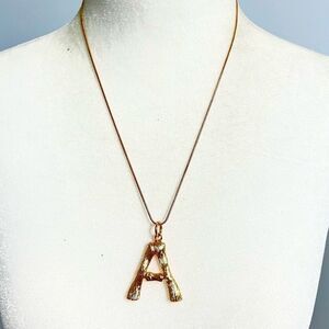 Gold A initial large pendant necklace